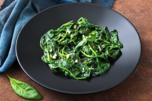 Vegetarian,Food,Cooked,Spinach,In,Black,Dish