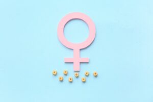 Paper,Symbol,Of,Woman,With,Word,Estrogen,On,Blue,Background Paper,Symbol,Of,Woman,With,Word,Estrogen,On,Blue,Background