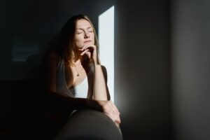 Deep,Portrait,Of,Thoughtful,Mature,Woman,Sitting,In,Sunlight,Beam Deep,Portrait,Of,Thoughtful,Mature,Woman,Sitting,In,Sunlight,Beam
