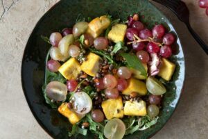 Flat,Lay,Of,Salad,Bowl,With,Tofu,And,Grapes,On